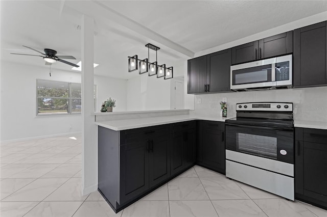 kitchen with decorative light fixtures, a textured ceiling, appliances with stainless steel finishes, kitchen peninsula, and ceiling fan