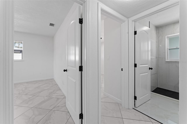 bathroom featuring a textured ceiling