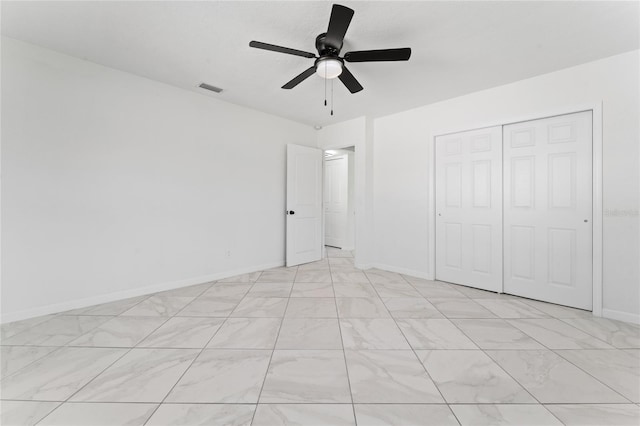 unfurnished bedroom with a closet and ceiling fan