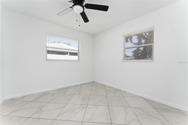 unfurnished room featuring ceiling fan