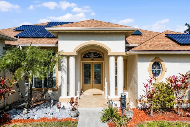 property entrance featuring french doors and solar panels