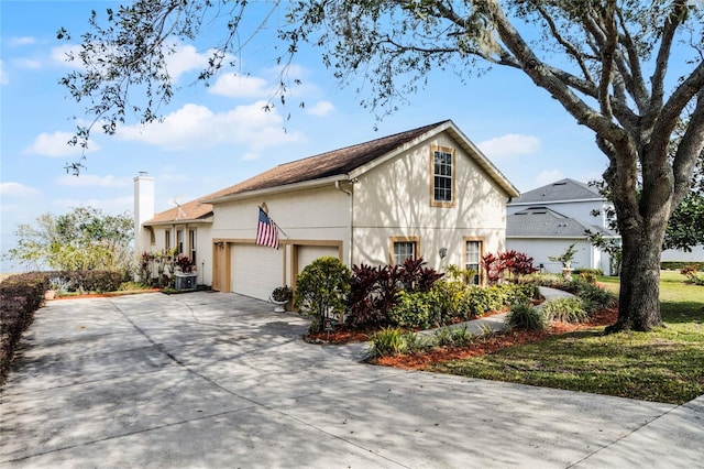 view of property exterior with a garage and a yard