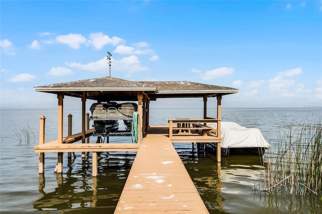 view of dock with a water view