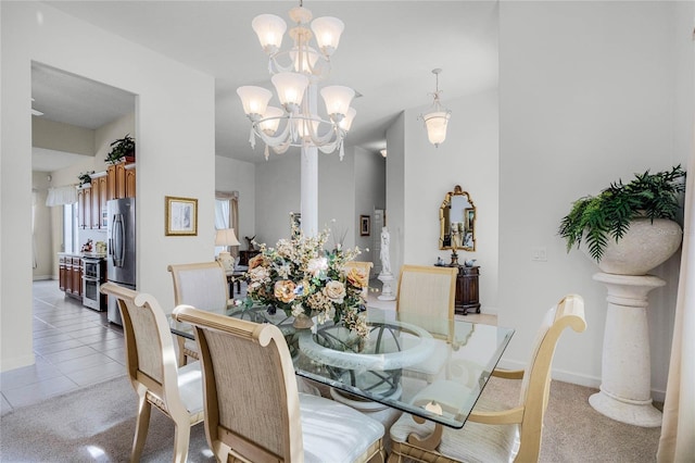 dining area with light colored carpet and a notable chandelier