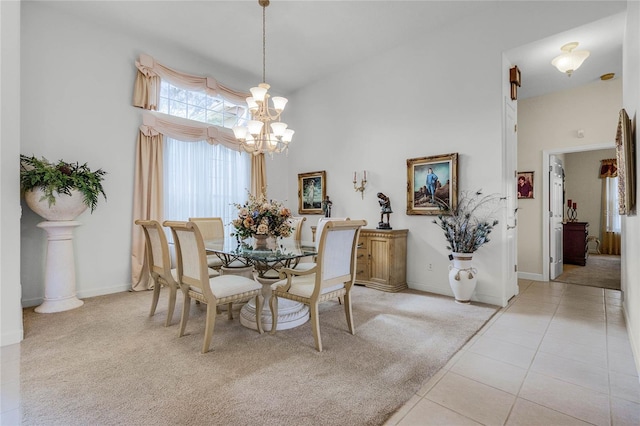 dining area featuring a notable chandelier, a towering ceiling, and light tile patterned floors