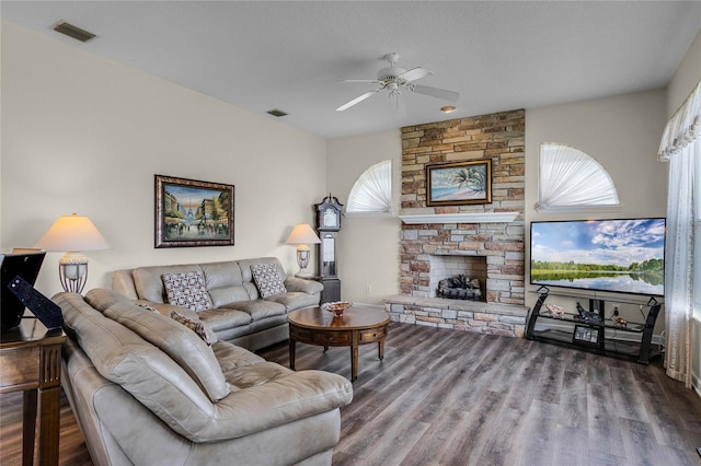 living room with hardwood / wood-style floors, a fireplace, a healthy amount of sunlight, and ceiling fan