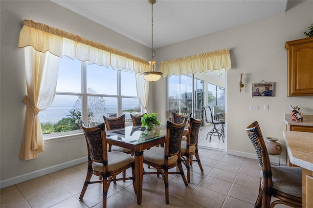 dining area with light tile patterned floors