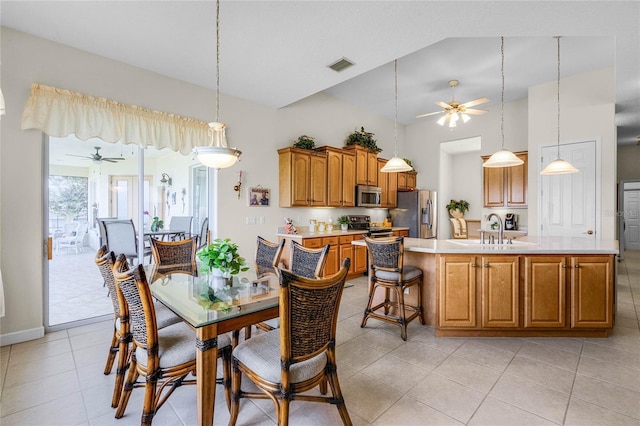 dining area featuring sink, high vaulted ceiling, ceiling fan, and light tile patterned flooring