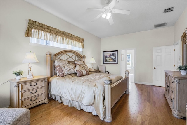 bedroom with hardwood / wood-style floors and ceiling fan