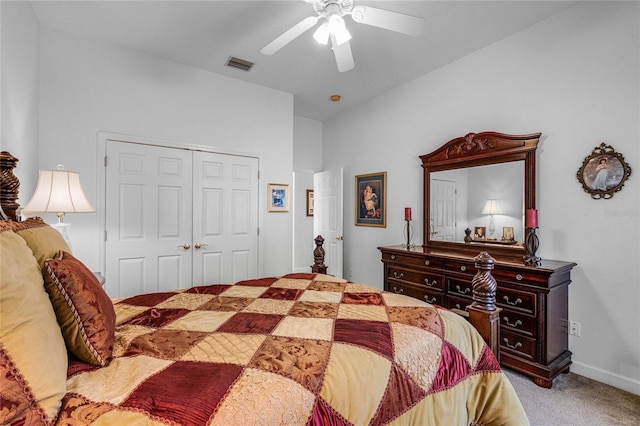 carpeted bedroom featuring ceiling fan and a closet