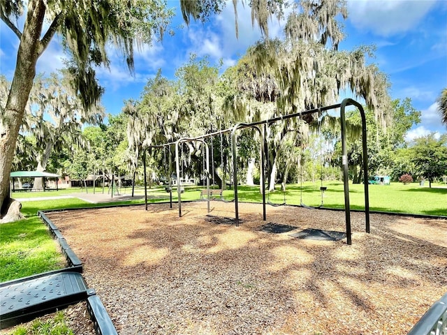 surrounding community with a lawn and a playground