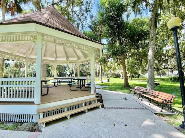 surrounding community featuring a gazebo and a lawn