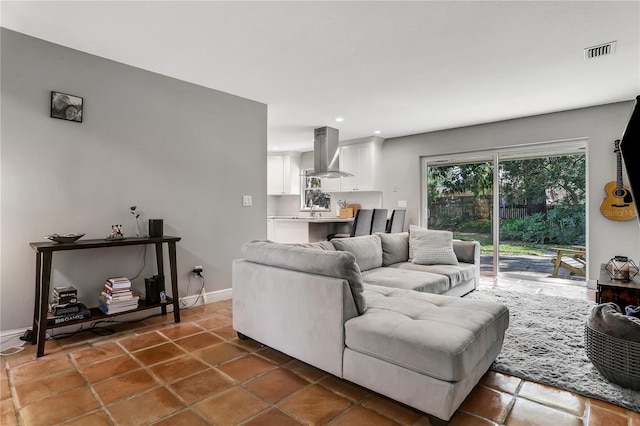 living room with dark tile patterned flooring