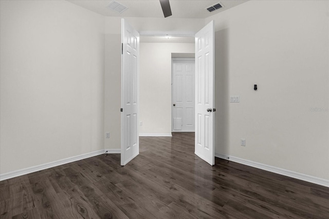 empty room featuring dark hardwood / wood-style flooring