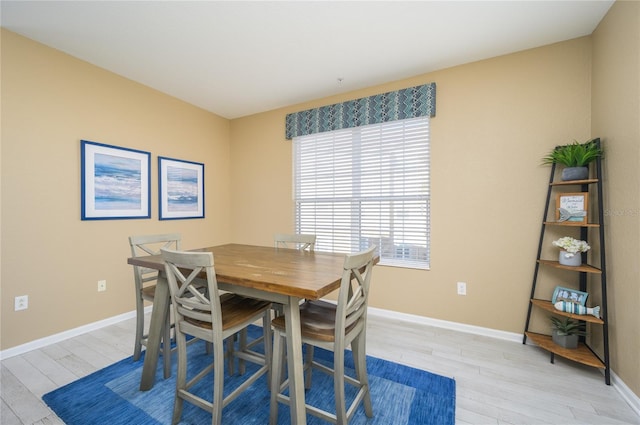 dining area with light wood-type flooring