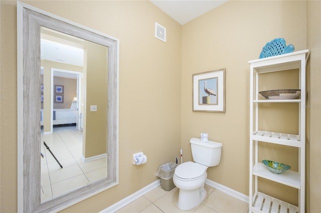 bathroom with tile patterned floors and toilet