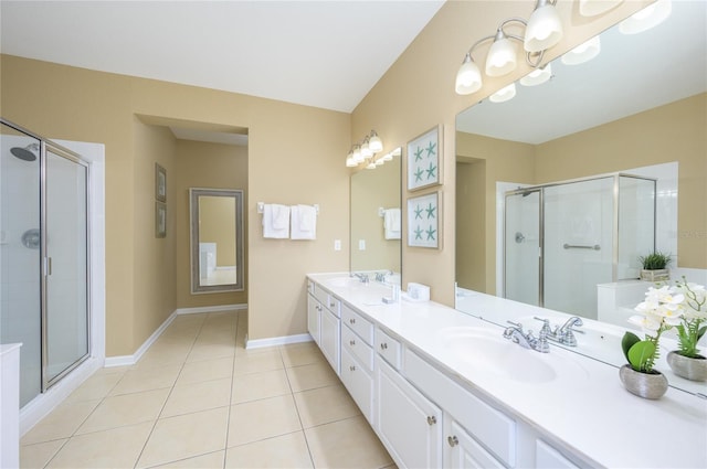 bathroom featuring vanity, tile patterned floors, and a shower with shower door