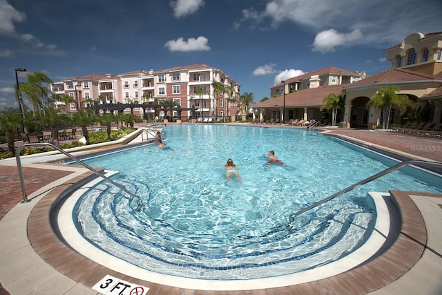 view of pool featuring a patio