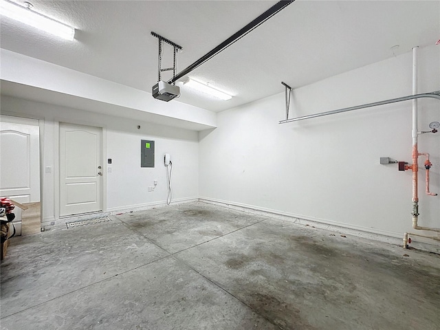 garage featuring a garage door opener and electric panel