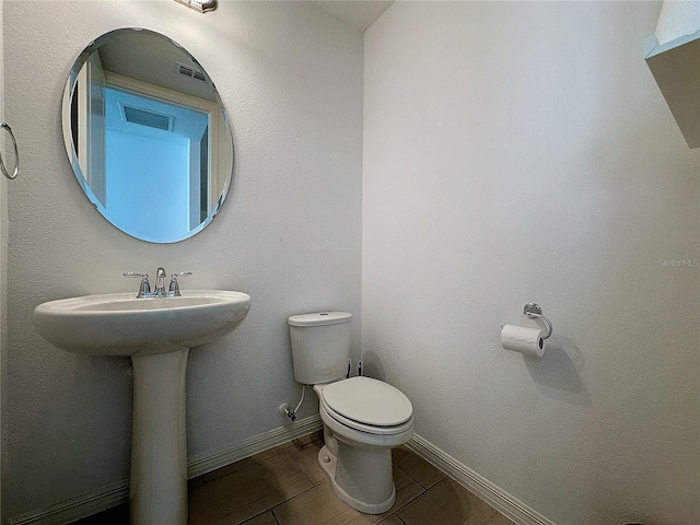 bathroom featuring toilet