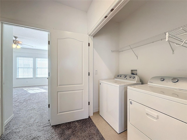 laundry area featuring separate washer and dryer, light colored carpet, and ceiling fan