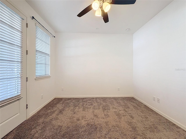 unfurnished room featuring ceiling fan and carpet flooring