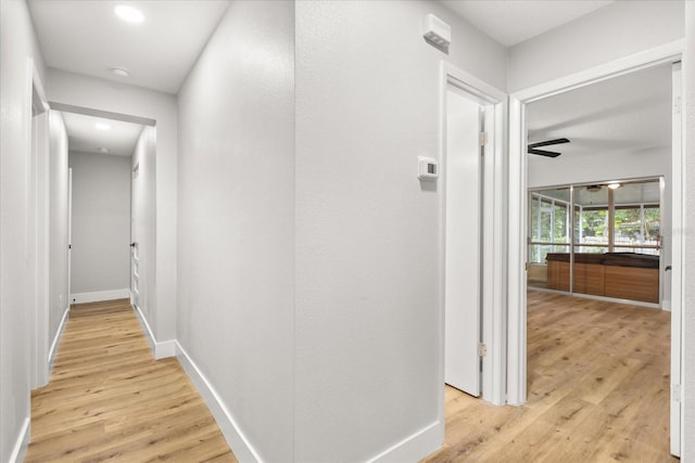 hall with light wood-type flooring