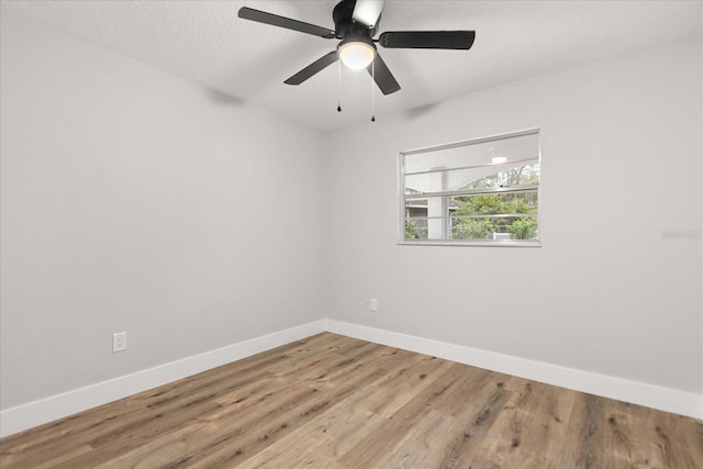 unfurnished room with wood-type flooring, ceiling fan, and a textured ceiling