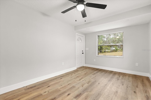 empty room featuring light hardwood / wood-style flooring and ceiling fan