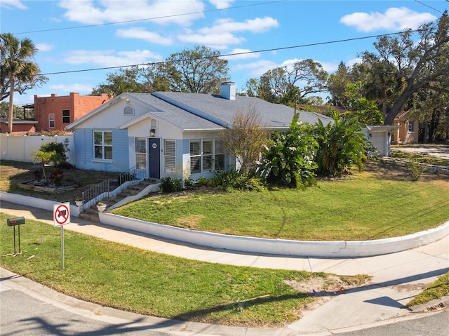 ranch-style home featuring a front yard