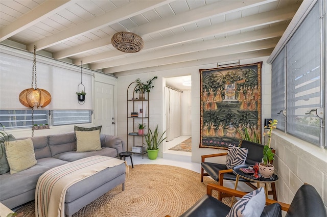 living area with beam ceiling