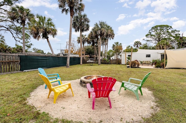 view of yard with a fire pit