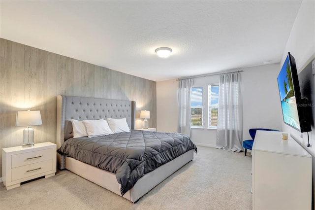 bedroom featuring light colored carpet