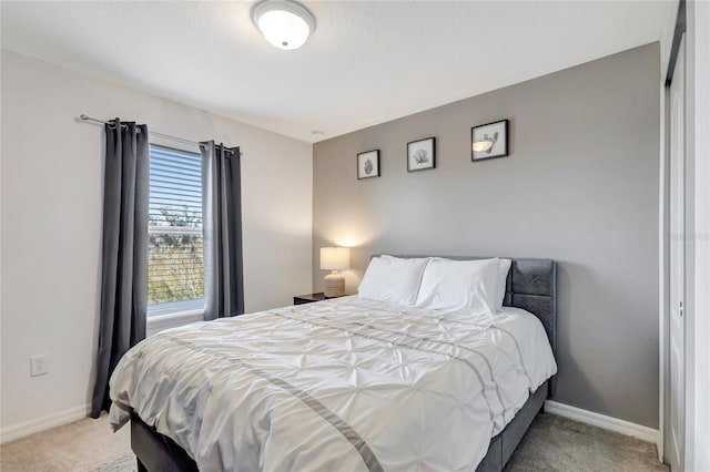 bedroom with light colored carpet