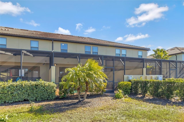 back of house featuring a lanai