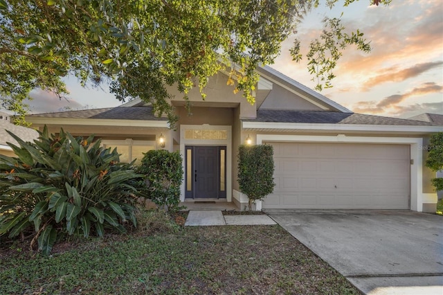 view of front of property with a garage