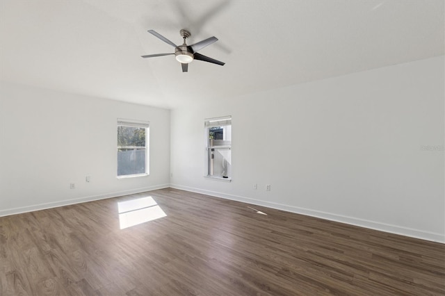 empty room featuring dark hardwood / wood-style floors and ceiling fan