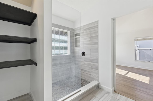 bathroom with tiled shower