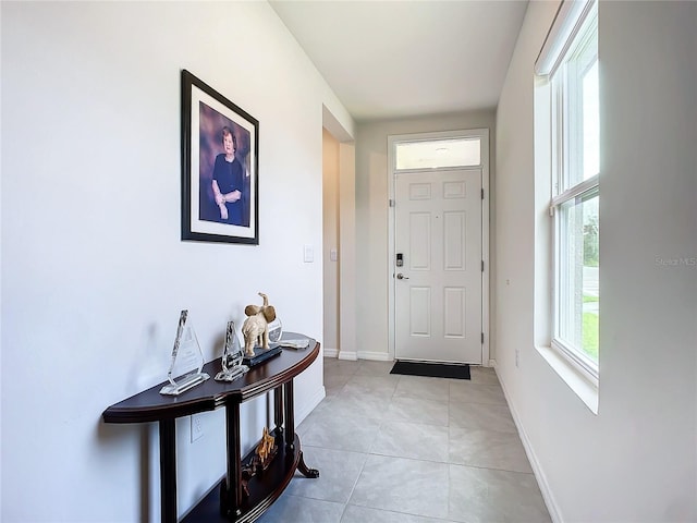 entryway featuring light tile patterned floors