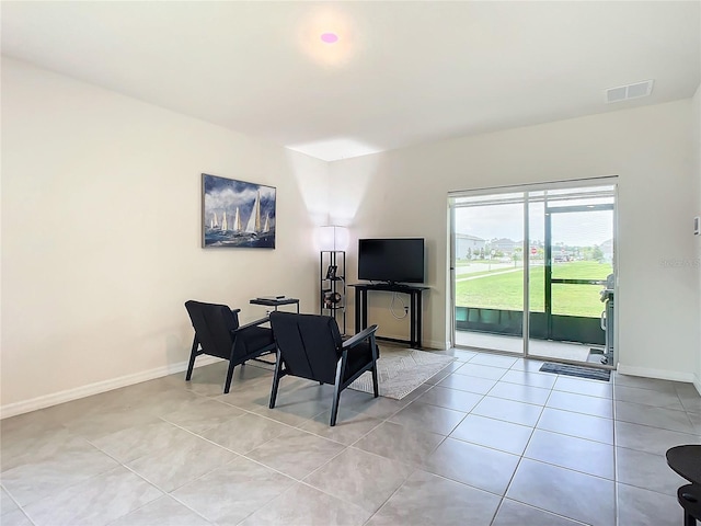 living area featuring light tile patterned flooring