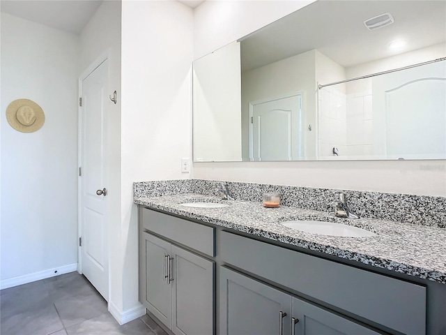 bathroom featuring tile patterned floors and vanity