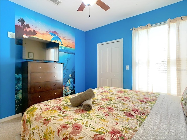 carpeted bedroom with ceiling fan