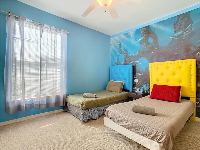 bedroom with ceiling fan and carpet floors