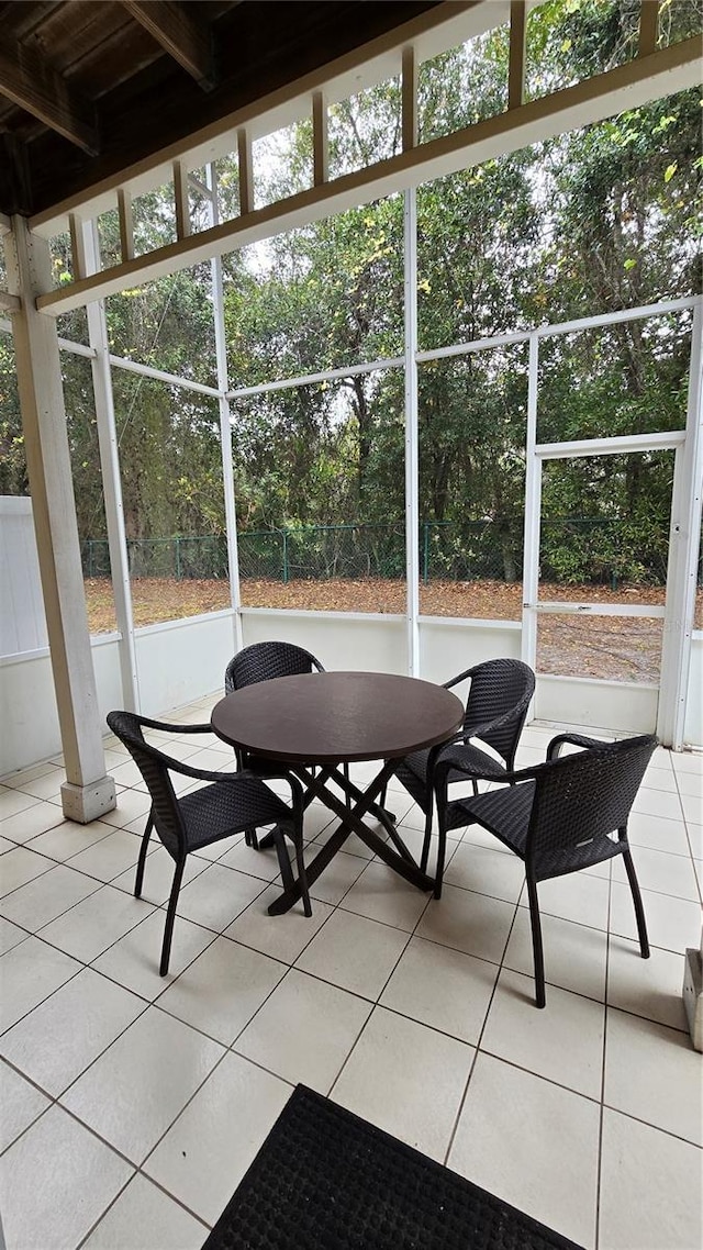 sunroom / solarium featuring a healthy amount of sunlight