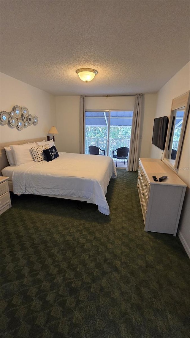 carpeted bedroom featuring access to exterior and a textured ceiling