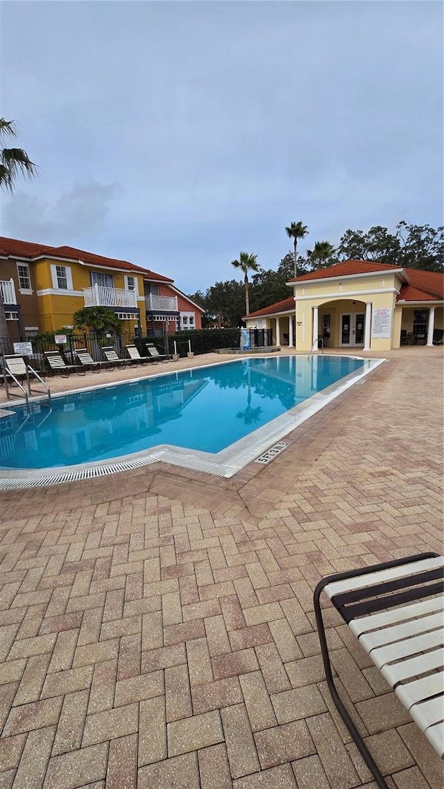 view of pool featuring a patio area