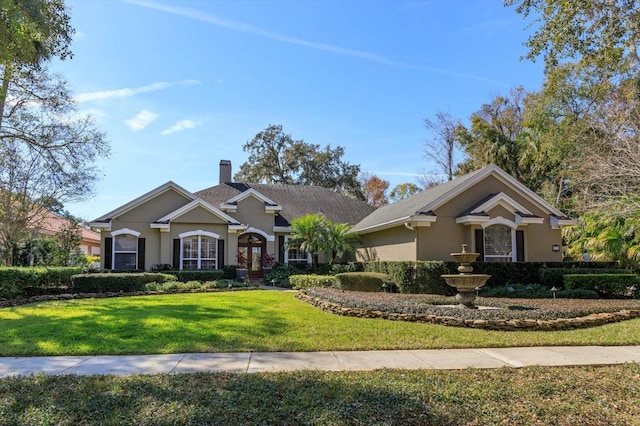 view of front of property with a front lawn