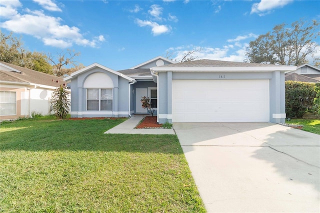 ranch-style house with a garage and a front yard