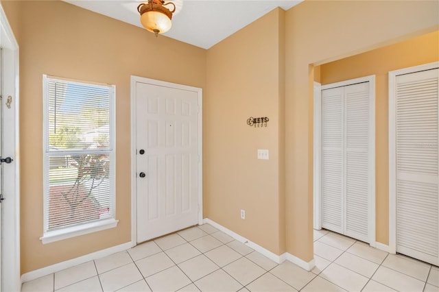 entrance foyer featuring light tile patterned floors