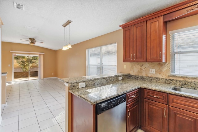 kitchen with light tile patterned flooring, decorative light fixtures, vaulted ceiling, stainless steel dishwasher, and kitchen peninsula